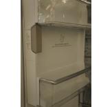 The automatic icemaker is built into the refrigerator door to save space in the freezer.