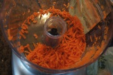 Shredding carrots in the KitchenAid food processor.